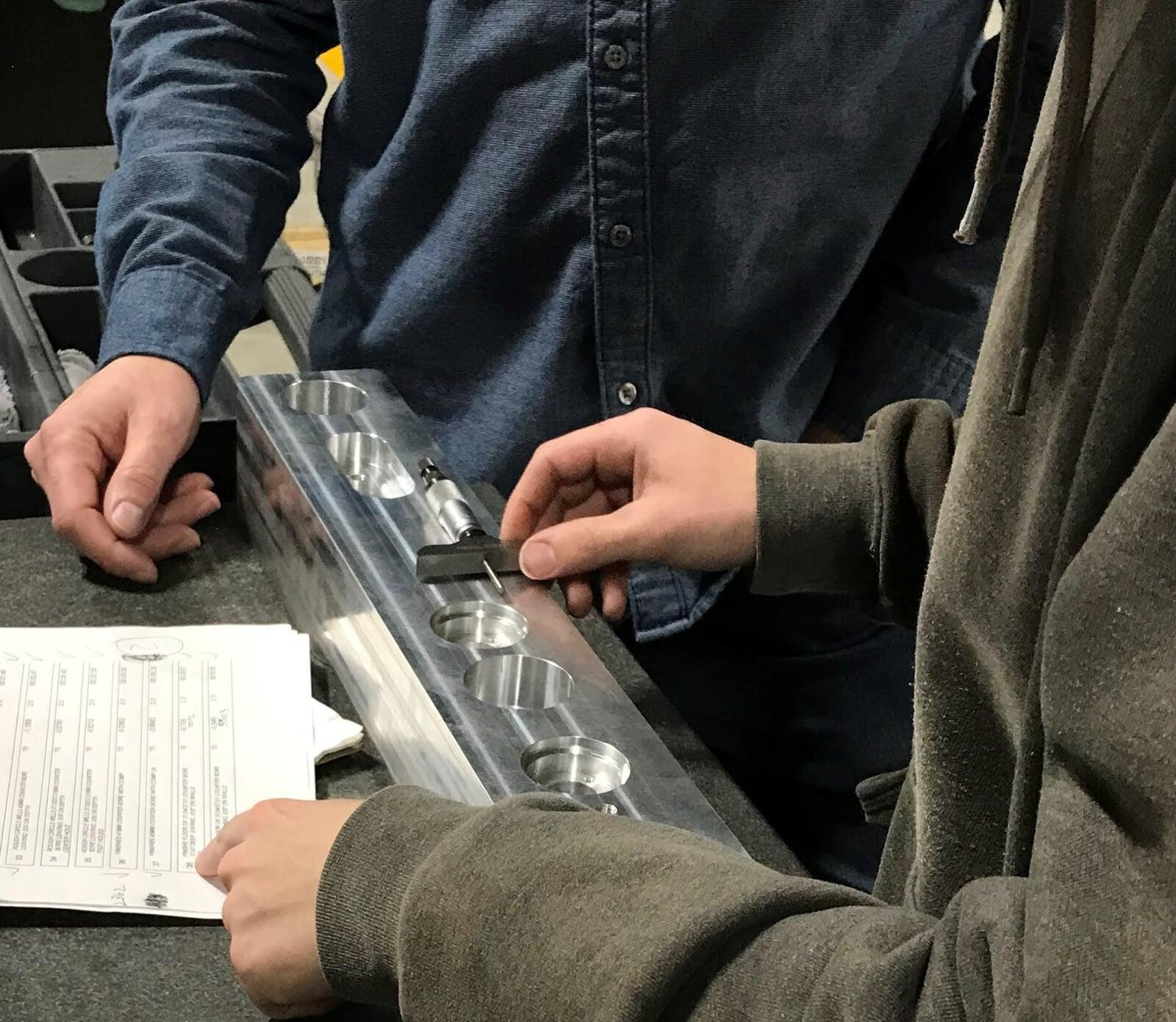 A CNC Machine part is undergoing in-process Inspection