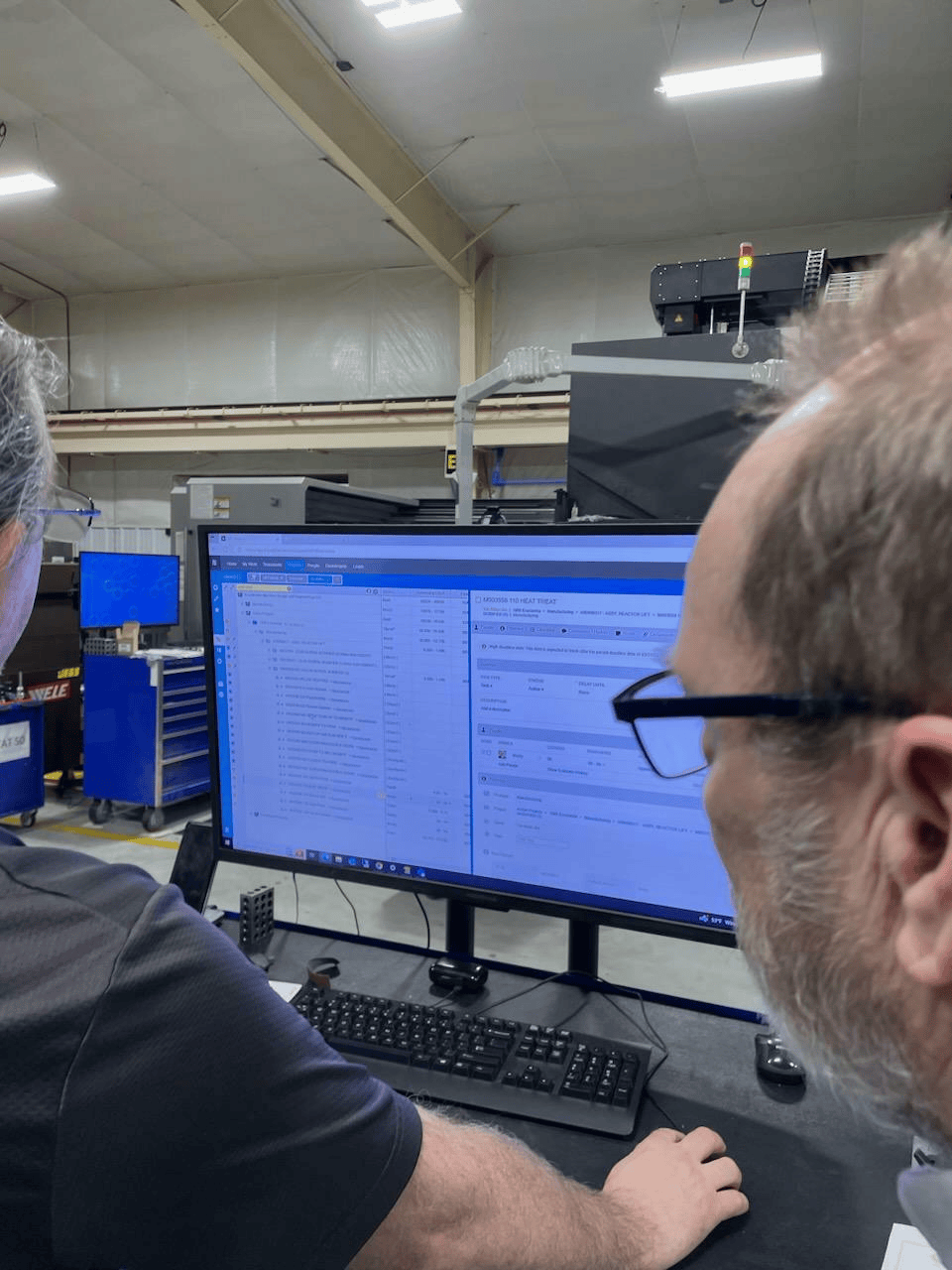 The manufacturing engineering team shows a CNC Machined part routing to an AS9100 Auditor